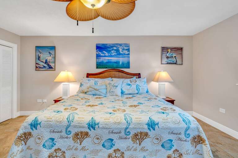 Florida Keys luxury rental master bedroom with walk-in closet, elegant furnishings, and panoramic views of the water. Florida Keys luxury rental master bedroom with walk-in closet, elegant furnishings, and panoramic views of the water.
