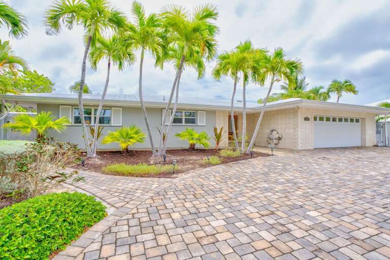 Front exterior highlighting oversized lot with ample parking and space for trailers or boats. Front exterior highlighting oversized lot with ample parking and space for trailers or boats.