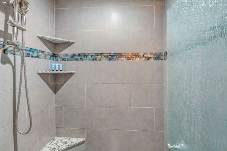 Luxury Florida Keys vacation rental master bathroom featuring a spacious walk-in shower with modern finishes and elegant design. Luxury Florida Keys vacation rental master bathroom featuring a spacious walk-in shower with modern finishes and elegant design.