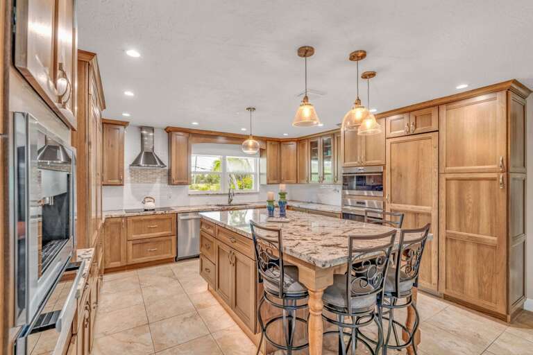 Newly remodeled Marathon FL vacation rental kitchen with Wolf oven, microwave, and induction cooktop for a chef-inspired stay. Newly remodeled Marathon FL vacation rental kitchen with Wolf oven, microwave, and induction cooktop for a chef-inspired stay.