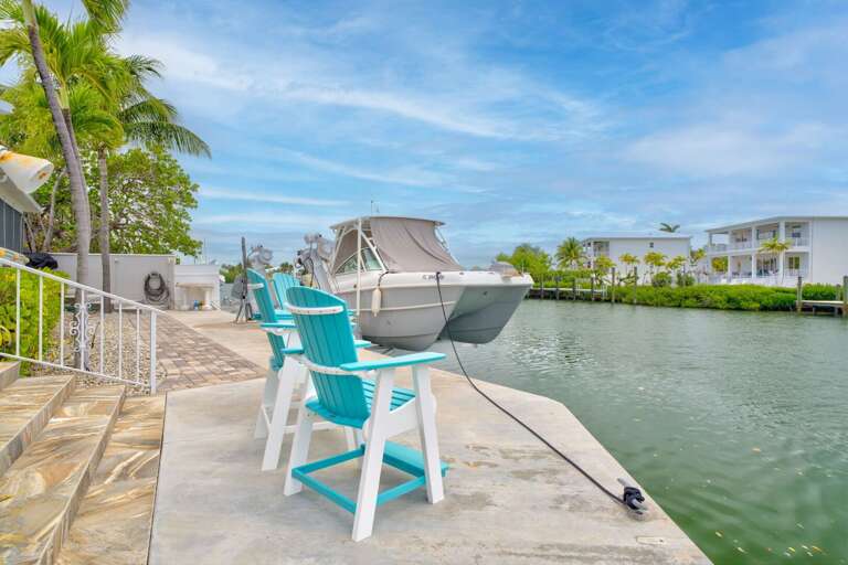 Private dock featuring fish cleaning station and boat access, perfect for Florida Keys fishing vacations in Marathon. Private dock featuring fish cleaning station and boat access, perfect for Florida Keys fishing vacations in Marathon.