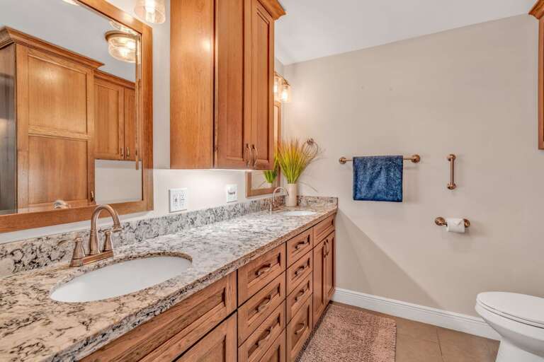 Remodeled master bathroom in a Florida Keys vacation rental with double vanity, walk-in shower, and luxury finishes for an upscale stay experience. Remodeled master bathroom in a Florida Keys vacation rental with double vanity, walk-in shower, and luxury finishes for an upscale stay experience.