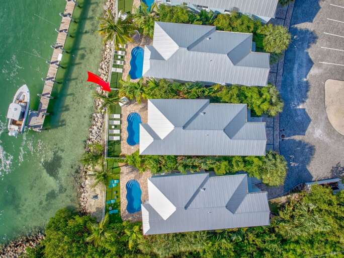 Dine and lounge outdoors while taking in breathtaking Gulf and Atlantic views from this Florida Keys vacation home.