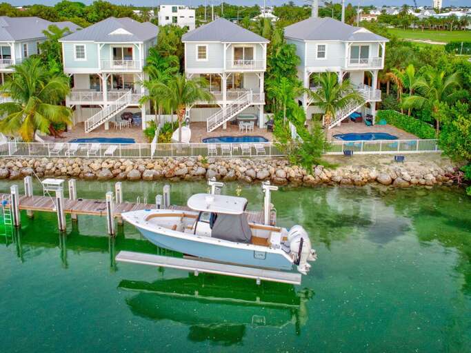 Enjoy breathtaking waterfront views, a private dock, pool, and hot tub at this upscale Florida Keys vacation rental.