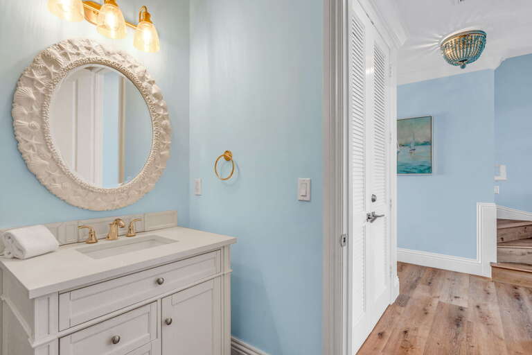 Enjoy convenience and style in this full bathroom on the second level of your Florida Keys vacation rental, perfect for family or group stays.