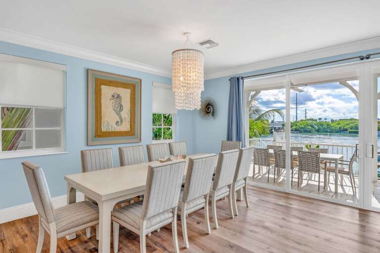 Enjoy meals indoors with oceanfront views in this Florida Keys vacation rental, ideal for family vacations or group retreats.