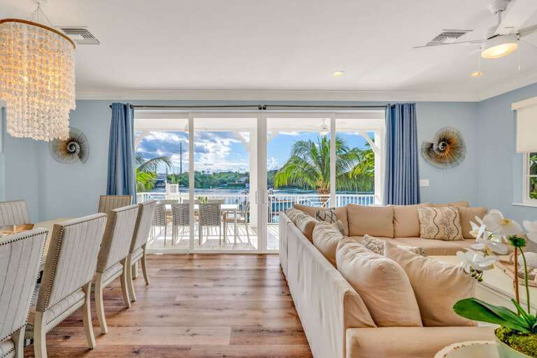 Enjoy serene waterfront views from this open-concept living area, designed for comfort, relaxation, and memorable family moments in the Florida Keys.