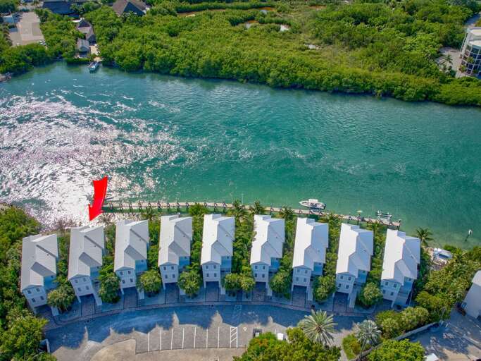 Enjoy sunrise and sunset over the water from private balconies in this Florida Keys vacation home.