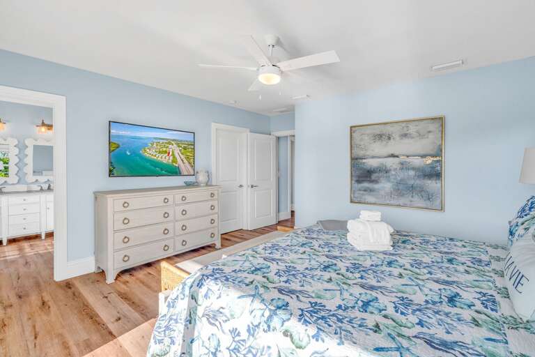 Enjoy ultimate comfort and luxury in the master suite of this Marathon FL rental, featuring king bedding, modern coastal décor, and stunning water vistas.