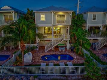 Experience the ultimate Marathon FL getaway in this spacious 5-bedroom, 4-bathroom waterfront rental featuring modern coastal décor and upscale amenities.