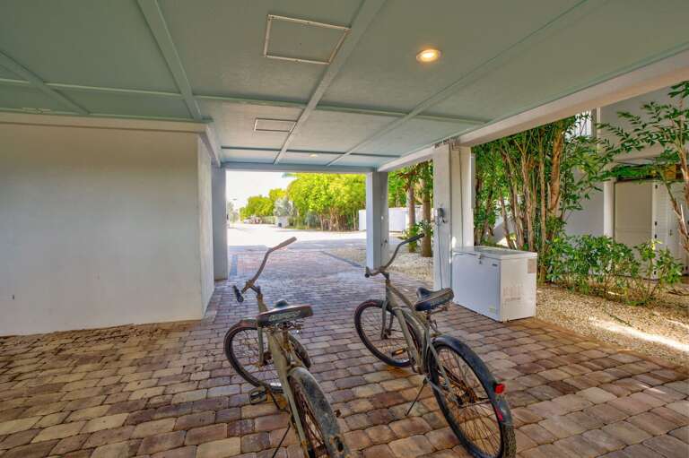 This Marathon FL oceanfront rental offers space for 3–4 cars plus trailers, including covered parking, perfect for families and boating guests.