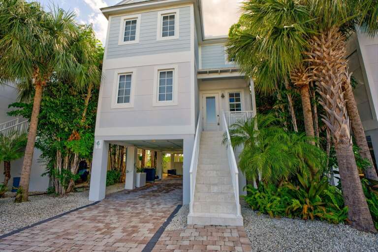 Ideal for families and groups, this luxury oceanfront home offers privacy, multiple balconies, and stunning panoramic water views.