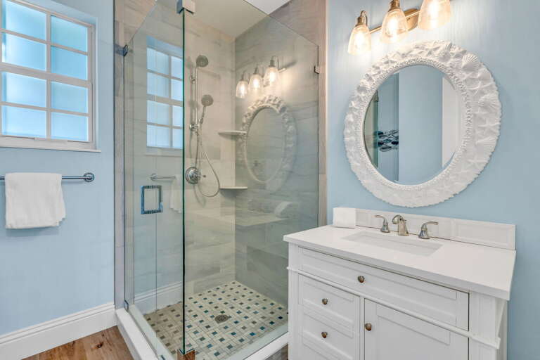 Modern and functional, this second-level bathroom features a shower, sleek fixtures, and coastal-inspired finishes for guest comfort in Marathon FL.