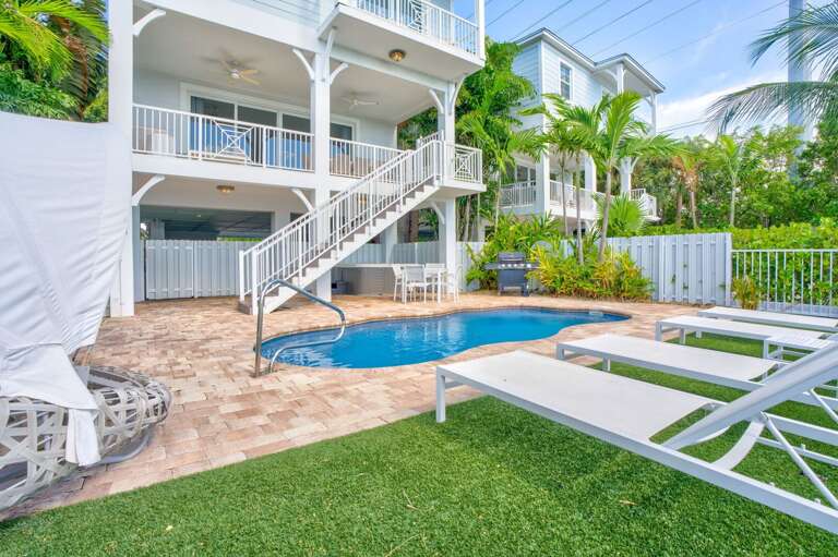 Take a refreshing dip in this private heated pool with panoramic Gulf and Atlantic views, perfect for families and groups in Marathon FL.