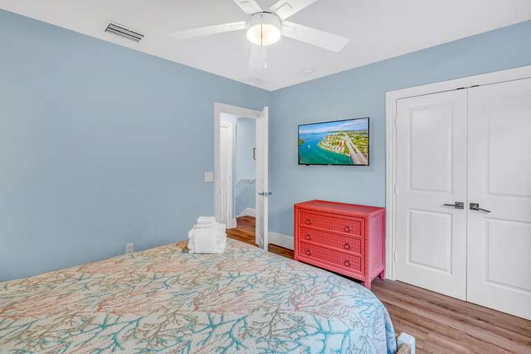 Relax in this cozy full guest bedroom, perfect for families or groups, offering comfort and easy access to the third-level shared bathroom.