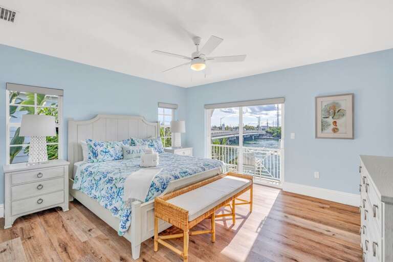 Relax in this luxurious Marathon FL vacation home master suite with a king bed, Smart TV, and panoramic Gulf and Atlantic views—perfect for a romantic getaway or family retreat.