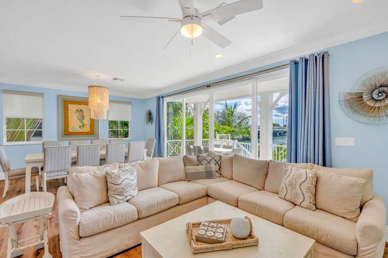 Stylish coastal décor, abundant natural light, and sweeping Gulf views make this living room perfect for Florida Keys family vacations.