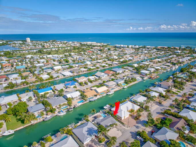 Aerial view of Key Colony Beach Florida Keys waterfront vacation rental on canal with direct Atlantic Ocean access.