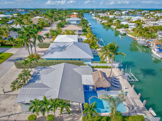 Aerial view showing canal access to Atlantic Ocean and private dock at Key Colony Beach Florida Keys waterfront rental. Aerial view showing canal access to Atlantic Ocean and private dock at Key Colony Beach Florida Keys waterfront rental.