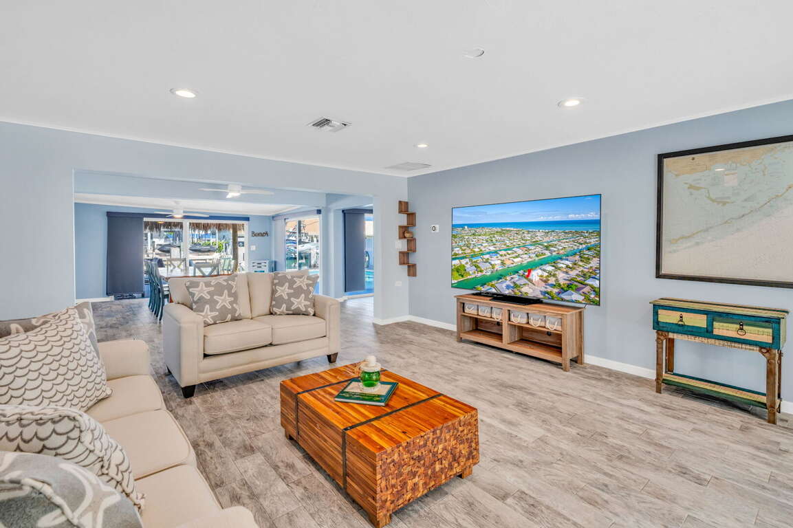 Bright living room with large Smart TV and waterfront views at Key Colony Beach Florida Keys rental. Bright living room with large Smart TV and waterfront views at Key Colony Beach Florida Keys rental.