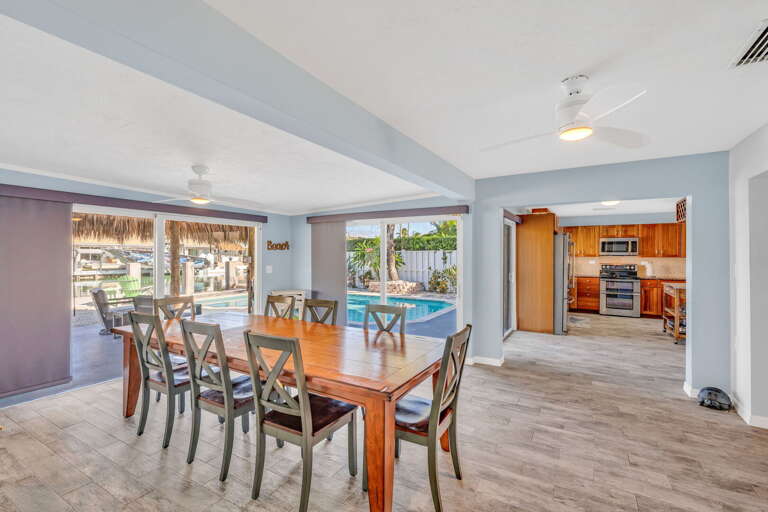 Dining table with seating for eight and panoramic ocean views at Key Colony Beach Florida Keys waterfront vacation home. Dining table with seating for eight and panoramic ocean views at Key Colony Beach Florida Keys waterfront vacation home.