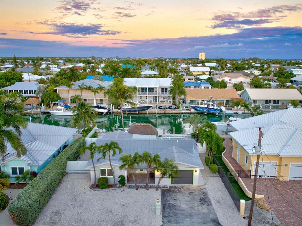 Drone photo of Key Colony Beach Florida Keys luxury waterfront vacation home with canal and private dock. Drone photo of Key Colony Beach Florida Keys luxury waterfront vacation home with canal and private dock.