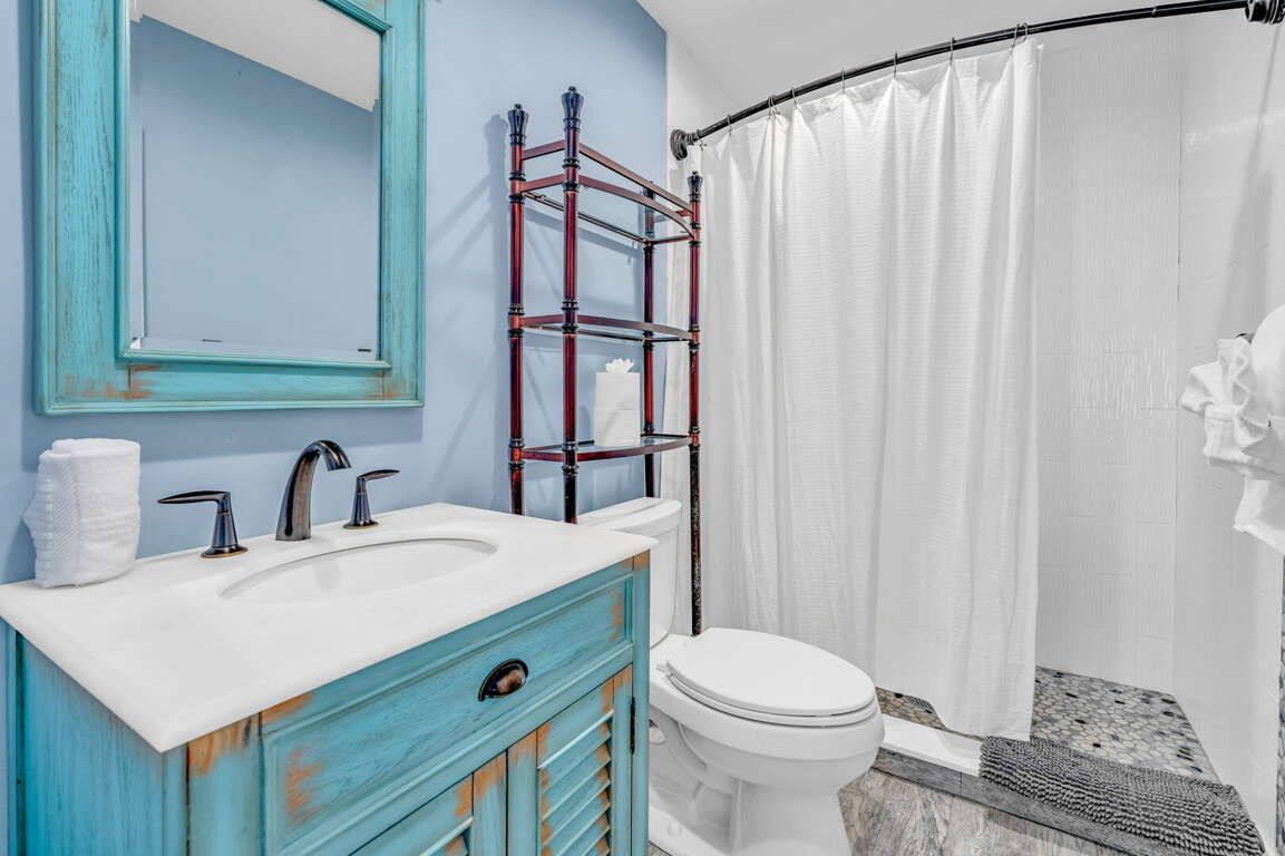 Elegant guest bathroom with shower and stylish fixtures in Key Colony Beach Florida Keys vacation rental. Elegant guest bathroom with shower and stylish fixtures in Key Colony Beach Florida Keys vacation rental.