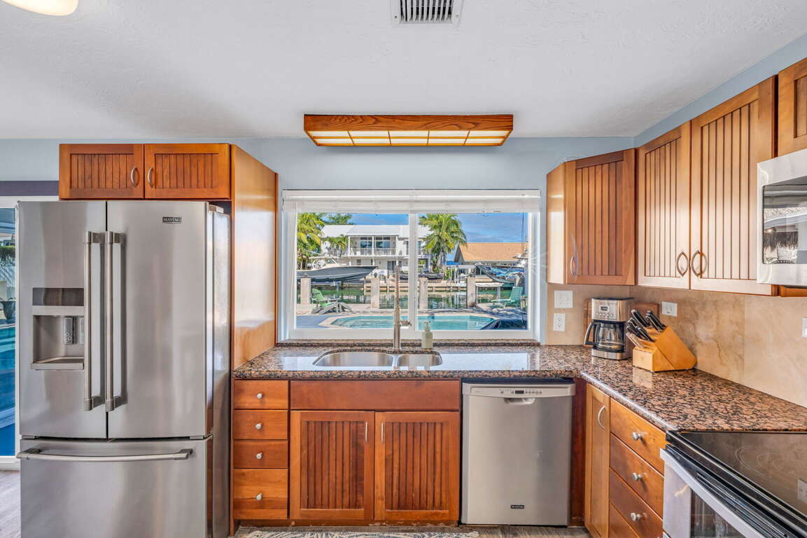 Fully equipped kitchen with stainless steel appliances and granite countertops in Florida Keys vacation home. Fully equipped kitchen with stainless steel appliances and granite countertops in Florida Keys vacation home.