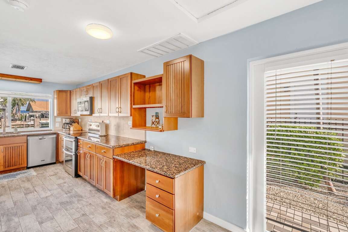 Fully stocked kitchen with cookware, Keurig coffee maker, and open layout at Florida Keys rental. Fully stocked kitchen with cookware, Keurig coffee maker, and open layout at Florida Keys rental.
