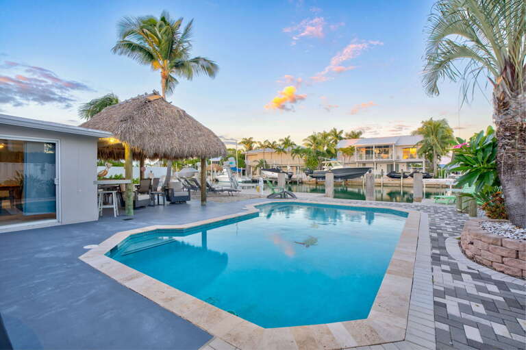 Heated pool at sunset with waterfront views at Key Colony Beach Florida Keys vacation rental. Heated pool at sunset with waterfront views at Key Colony Beach Florida Keys vacation rental.