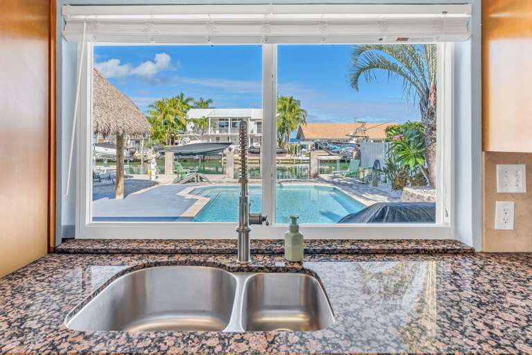 Modern open-concept kitchen with ocean views at Key Colony Beach Florida Keys waterfront vacation rental. Modern open-concept kitchen with ocean views at Key Colony Beach Florida Keys waterfront vacation rental.
