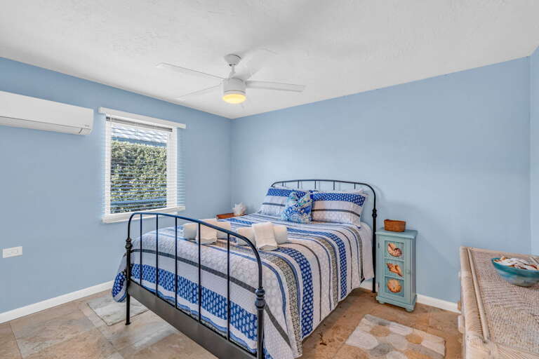 Peaceful queen bedroom with bright natural light in Key Colony Beach Florida Keys luxury rental. Peaceful queen bedroom with bright natural light in Key Colony Beach Florida Keys luxury rental.