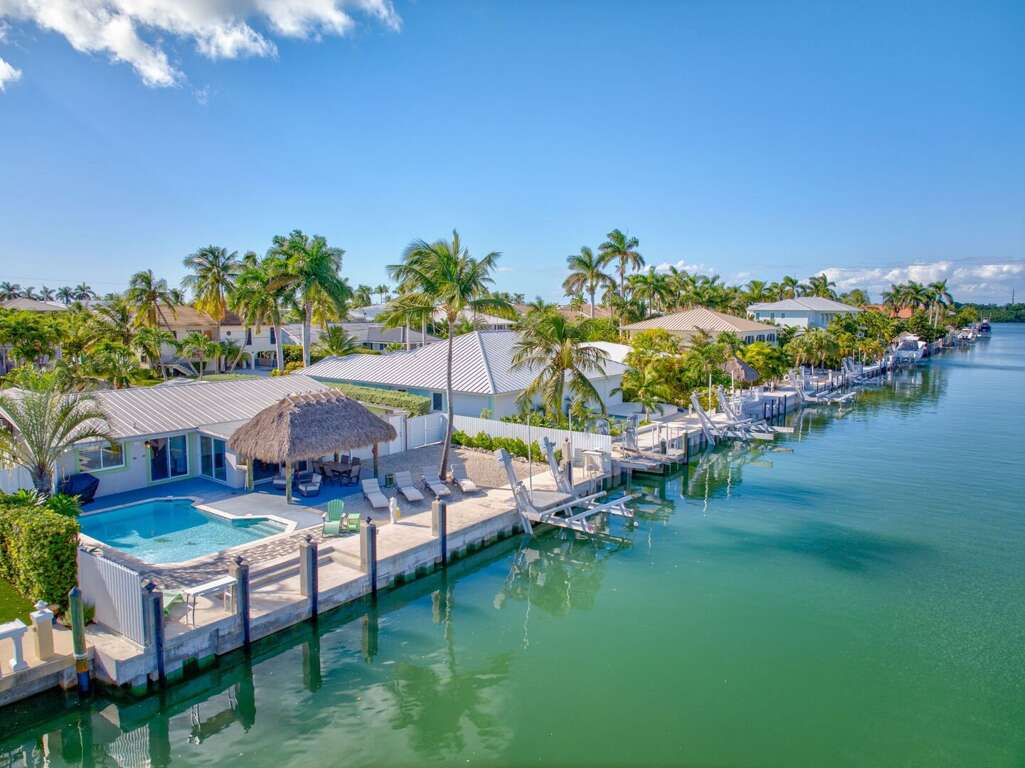 Private boat slip with lift at Florida Keys oceanfront vacation home. Private boat slip with lift at Florida Keys oceanfront vacation home.