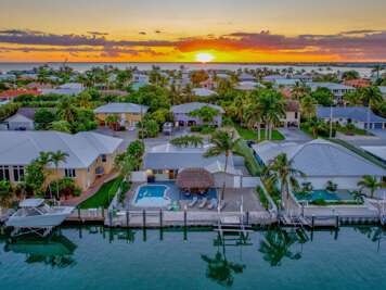 Private pool at luxury Florida Keys vacation rental with sunset views over the water.