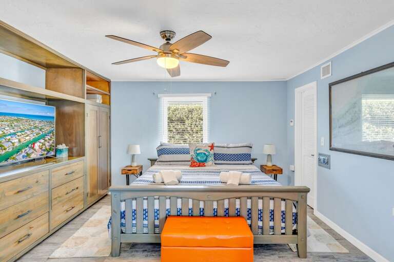 Spacious master suite with king bed, Smart TV, and tropical decor in Key Colony Beach Florida Keys vacation rental. Spacious master suite with king bed, Smart TV, and tropical decor in Key Colony Beach Florida Keys vacation rental.