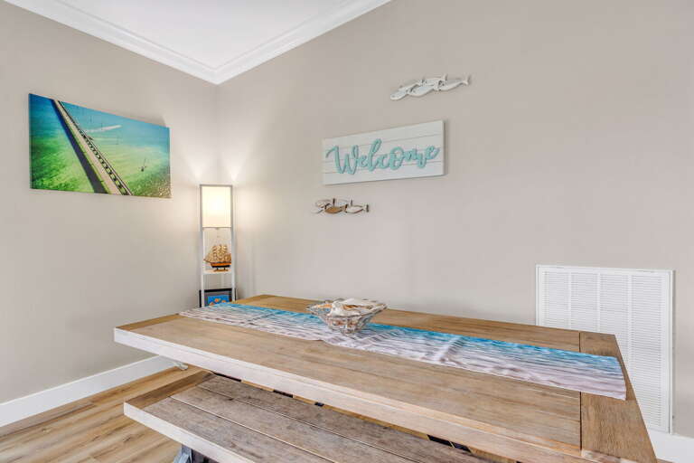 Bright and airy dining room, step onto the balcony for views overlooking the boat dock and canal.