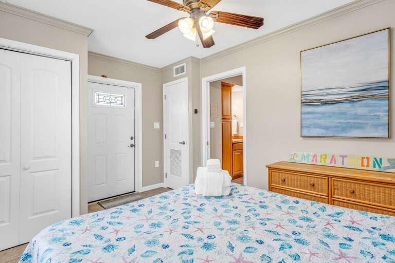 Bright and secluded guest suite with its own living room, canal views, and modern bathroom inside a premier Florida Keys pool and dock home