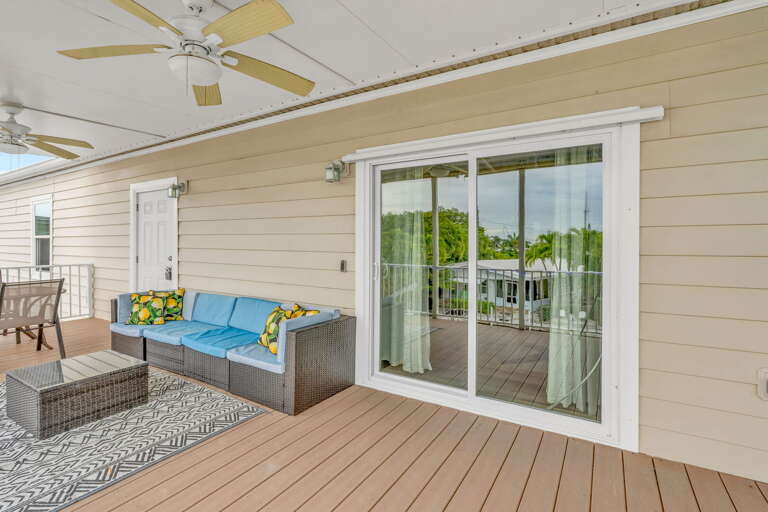 Elevated outdoor space with water views, seating for family meals, and a perfect spot to unwind during your Florida Keys vacation.
