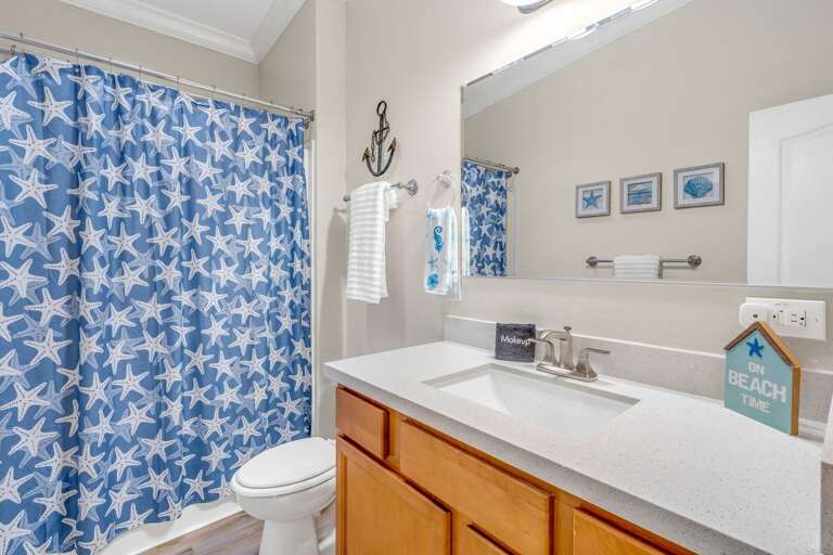 Modern fixtures and beach-inspired décor for a relaxing stay.