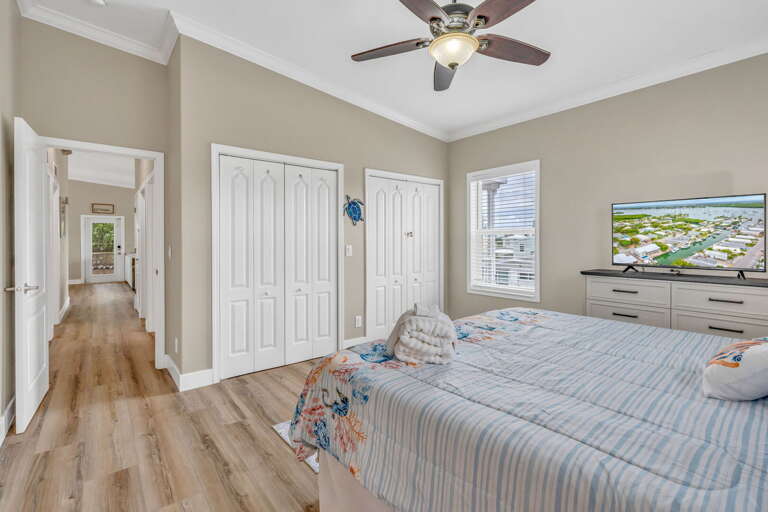 Peaceful ensuite master bedroom overlooking the private dock and tropical waterway.
