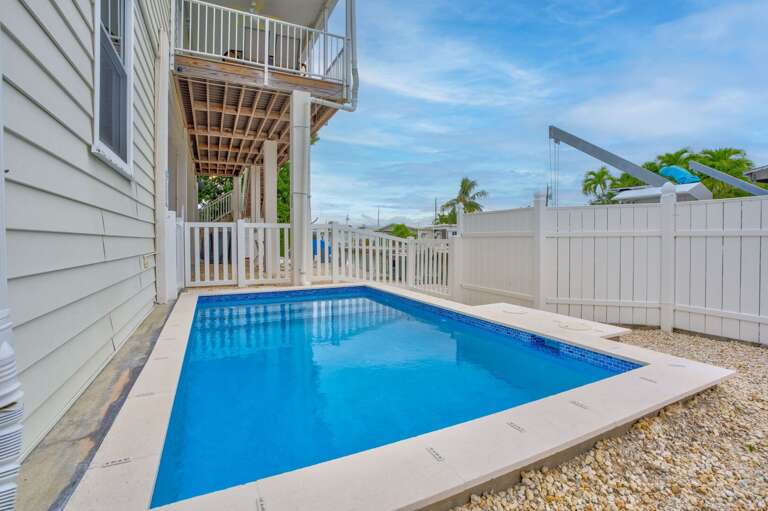 Private pool with stunning canal views, perfect for boating families.