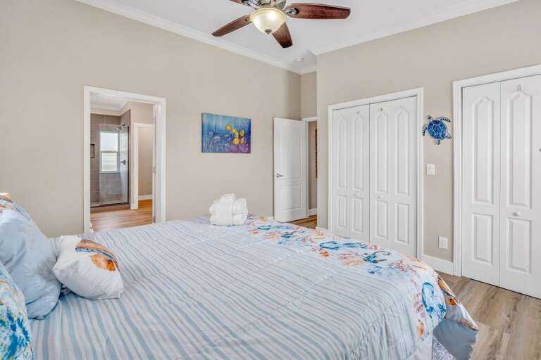 Restful master suite with modern bath, ideal for multi-family and extended stays in the Keys.