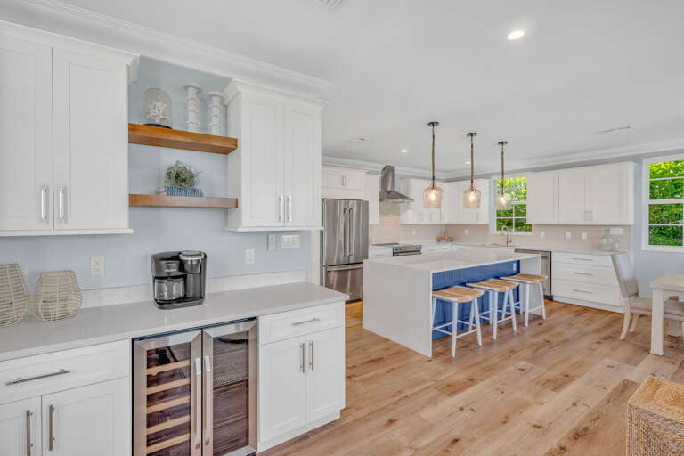 Beautifully updated kitchen with modern finishes and seamless flow to the wet bar, dining and
