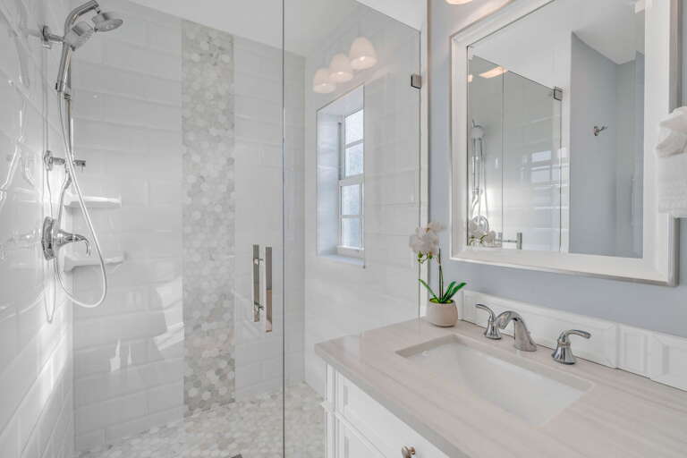 Elegant ensuite bathroom featuring walk-in shower, and luxury finishes—perfect for guests seeking upscale Florida Keys accommodations.