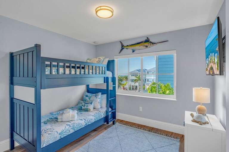 Fun and spacious bunk bedroom perfect for kids and groups staying in a family-friendly Marathon FL vacation home with pool and community dock area.