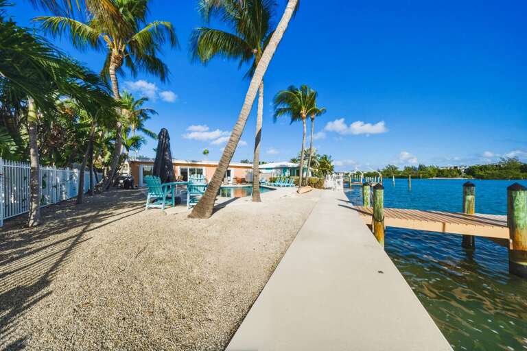 Canal-front dock with fish cleaning station at a Florida Keys vacation home perfect for anglers.