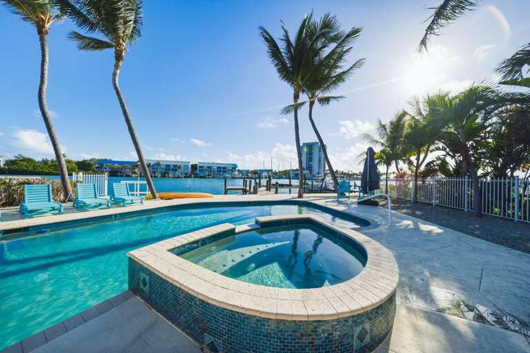 Relax in a tropical outdoor oasis with private pool and hot tub at this luxury Marathon Florida Keys vacation rental.