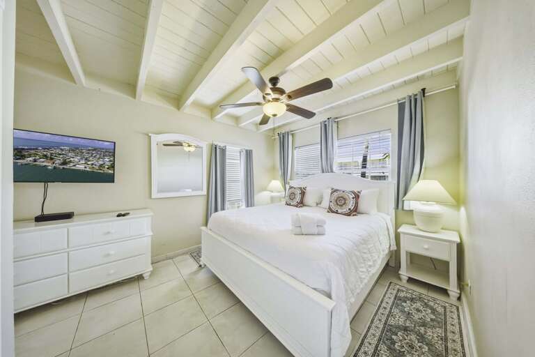 Spacious second king bedroom in a Marathon FL waterfront vacation rental with beautiful views and upscale furnishings.