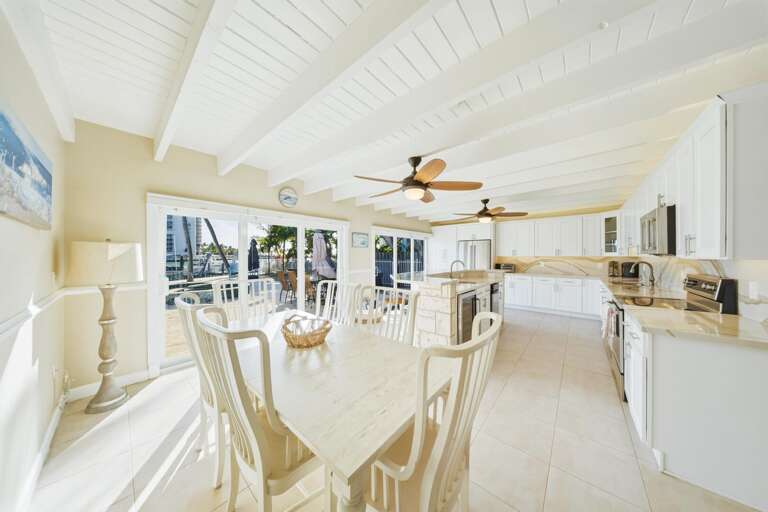 Spacious kitchen designed for entertaining in a Marathon FL waterfront vacation rental with easy access to the dining room and poolside patio.