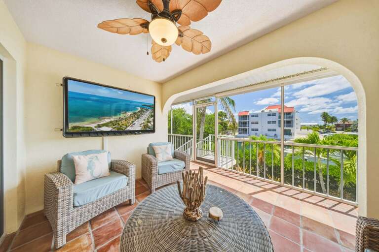 Take advantage of this inviting screened outdoor space, perfect for families to gather, relax, and enjoy the canal views. A standout feature of your Marathon FL waterfront vacation home.